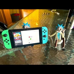 Rick and Morty phone holder also is compatible with iPad and Nintendo switch.